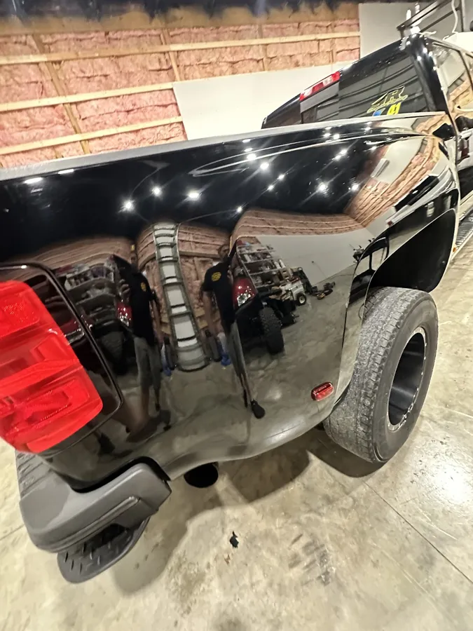 Paint correction gloss on a black dually pickup bed