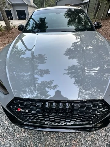 Reflection in the hood of a freshly polished Audi RS5
